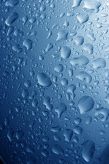 water drops on metalic blue background