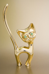 Fototapeta premium aureate holder for rings in the form of cat