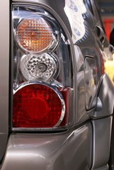 Car hedlight close-up. Turn, stop and reverse signals.