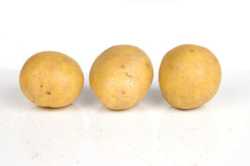 three potatoes on white
