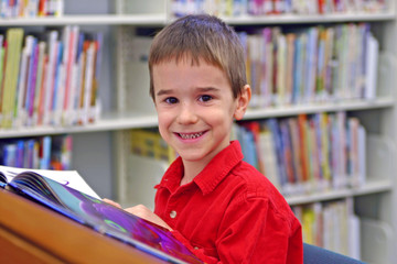 boy reading in library