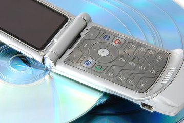 a cell phone and cds