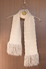 knitted scarf on a hanger.