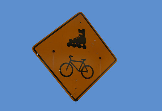 attention cyclists and rollerbladers sign