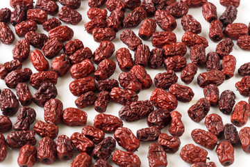 dried chicken hearts dates on white
