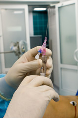 syringe in physician's hands