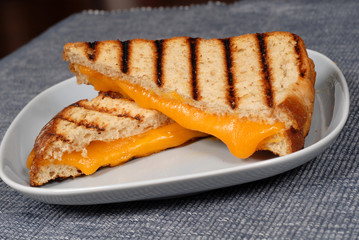 grilled cheese sandwich on a blue plate