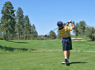 young golfer hitting a nice tee shot