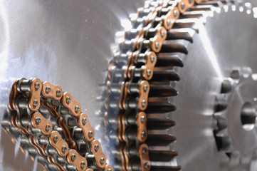 giant gears being powered by chain against titaniu