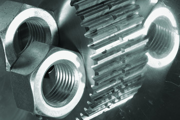 gears surrounded by large nuts