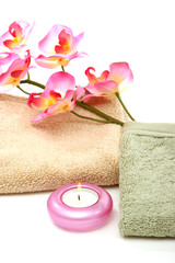 Obraz na płótnie Canvas spa towels, candle and pink orchid