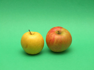 apples pair on green background