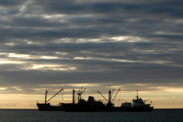 Fototapeta na wymiar cargo boats at sunset
