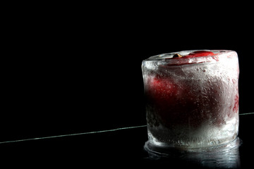 frozen apple standing on reflection