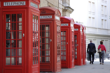 red telephone boothes in london street