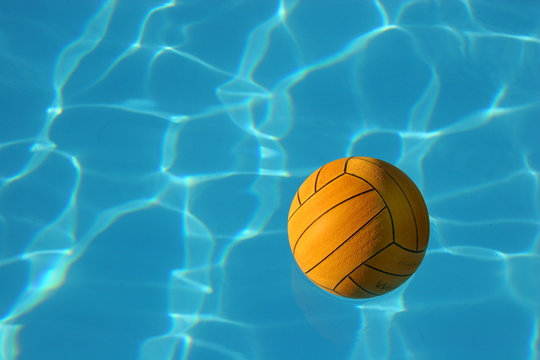 Yellow Waterpolo Ball In Blue Pool