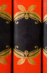 bright red ornate books with no titles - add your own text