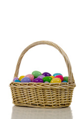 Fototapeta na wymiar easter egg basket with multicolored eggs