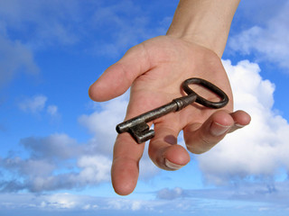 hand with a key.