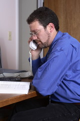 middle-aged man working in a home office