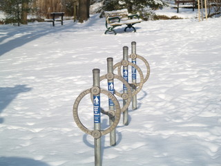 bicycle parking stands in the snow