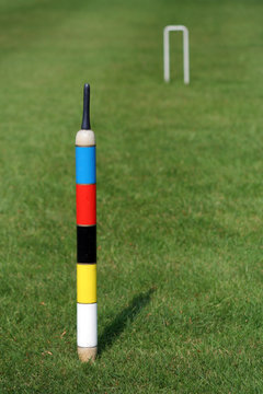 an english croquet lawn, the focus on the centre peg