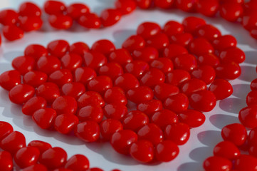 valentine red candies on a flat background