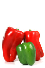 green and red peppers on a white background