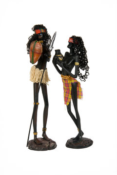 figurines of two women on a white background