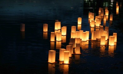 japanese lanterns floating on a lake