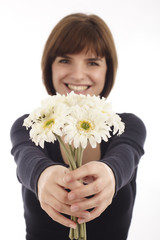 pretty young  woman offering flowers