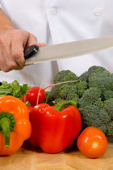 fresh vegetables on cutting board with knife