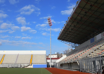 Naklejka premium empty tribunes on soccer stadium 2