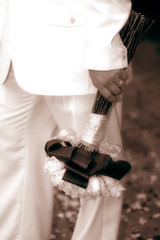 Naklejka premium groom holding bouquet