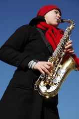 Fototapeta premium girl with saxophone