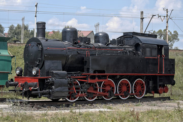 old steam engine at station