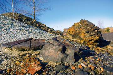 Obraz premium two stones at the bottom of striped hill with trees