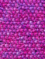 Fototapeta na wymiar knitted wool pink colors texture background.