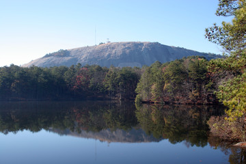 stone mountain,  reflected in a lake