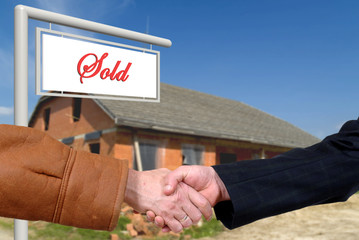 business deal, handshake on house sale