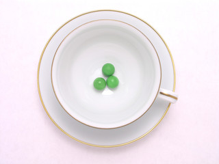 three green candy balls