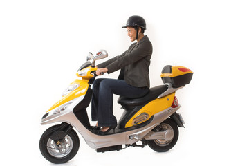 Fototapeta na wymiar woman riding scooter