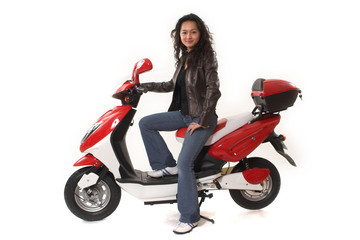 Fototapeta na wymiar woman riding electric scooter with no helmet