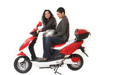 Fototapeta na wymiar couple girls talking on scooter