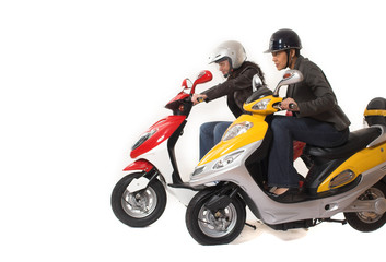 Fototapeta na wymiar couple girls racing on electric scooter