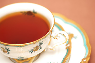 cup of black tea on biege background