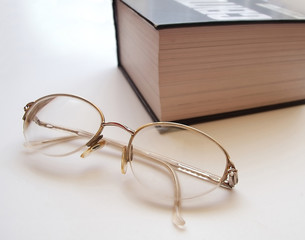 spectacles and book