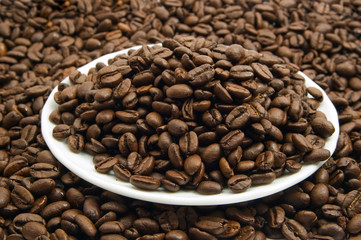 saucer with coffee beans