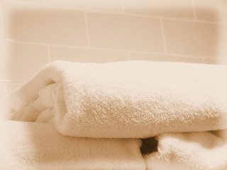 Fototapeta na wymiar a pile of folded plush towels in a bathroom