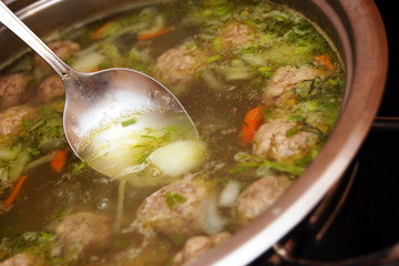 tasty soup with meat-balls in a saucepan